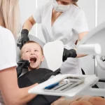 Young child during first dental visit at clinic